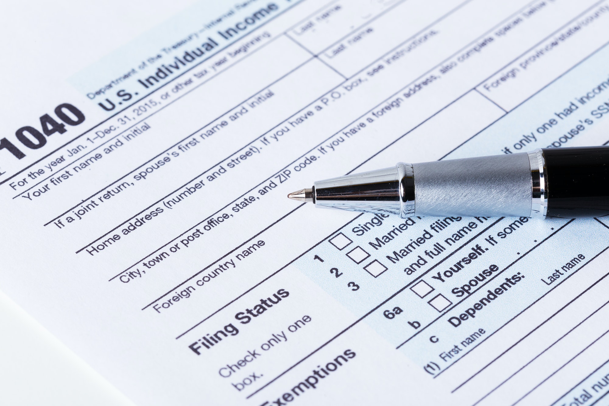 Income tax form and pen